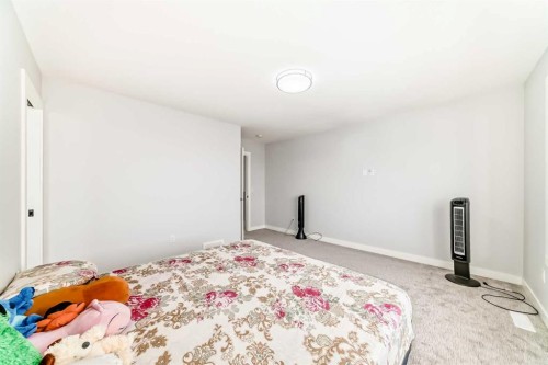 82 Waterford Crescent, Chestermere, AB - Indoor Photo Showing Bedroom