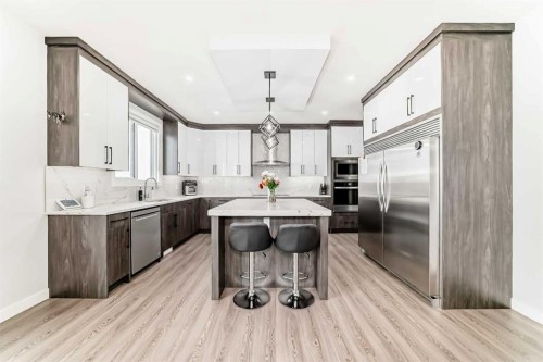 82 Waterford Crescent, Chestermere, AB - Indoor Photo Showing Kitchen With Upgraded Kitchen