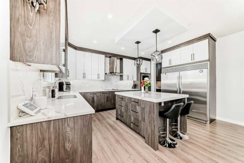 82 Waterford Crescent, Chestermere, AB - Indoor Photo Showing Kitchen With Upgraded Kitchen