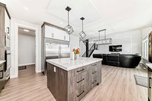 82 Waterford Crescent, Chestermere, AB - Indoor Photo Showing Kitchen With Upgraded Kitchen