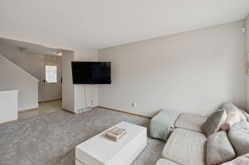 72 Mt Apex Green Se, Calgary, AB - Indoor Photo Showing Living Room