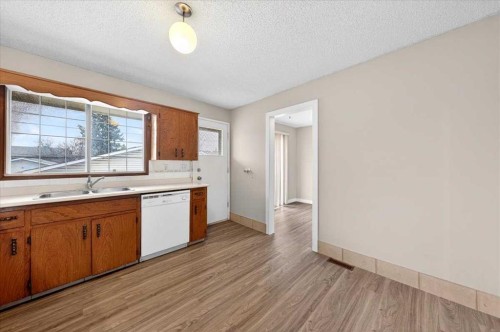 4748 Rundlehorn Drive Ne, Calgary, AB - Indoor Photo Showing Kitchen With Double Sink