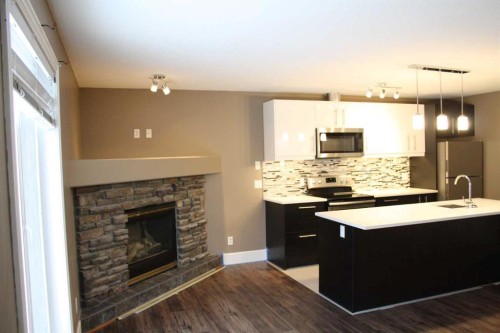 37 Chaparral Ridge Link Se, Calgary, AB - Indoor Photo Showing Other Room With Fireplace