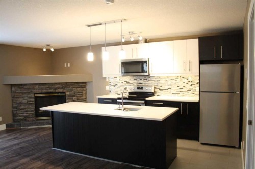 37 Chaparral Ridge Link Se, Calgary, AB - Indoor Photo Showing Kitchen With Double Sink With Upgraded Kitchen