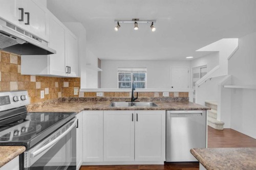 281 Elgin Gardens Se, Calgary, AB - Indoor Photo Showing Kitchen With Double Sink