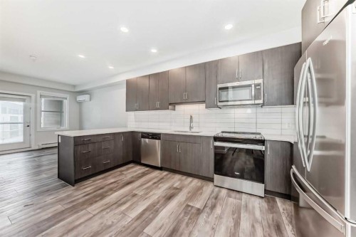 311-55 Wolf Hollow Crescent Se, Calgary, AB - Indoor Photo Showing Kitchen With Upgraded Kitchen