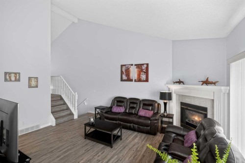 156 Sunlake Gardens Se, Calgary, AB - Indoor Photo Showing Living Room With Fireplace