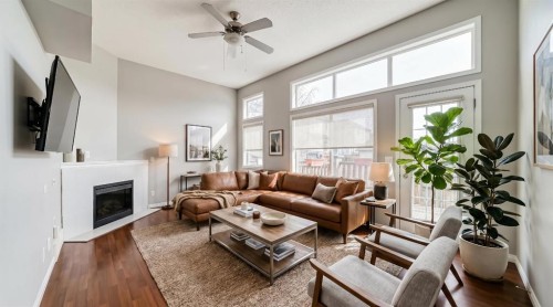 17 Copperfield Court Se, Calgary, AB - Indoor Photo Showing Living Room With Fireplace