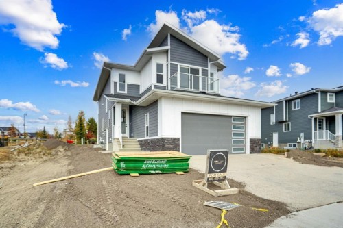 75 Sunvalley Way, Cochrane, AB - Outdoor With Facade