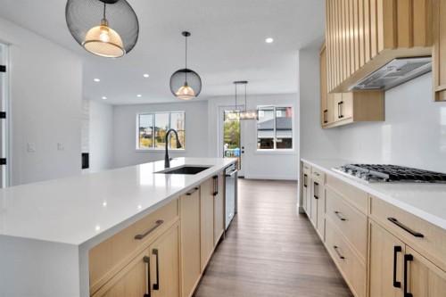 75 Sunvalley Way, Cochrane, AB - Indoor Photo Showing Kitchen With Upgraded Kitchen