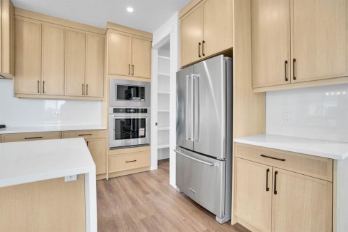 75 Sunvalley Way, Cochrane, AB - Indoor Photo Showing Kitchen With Stainless Steel Kitchen
