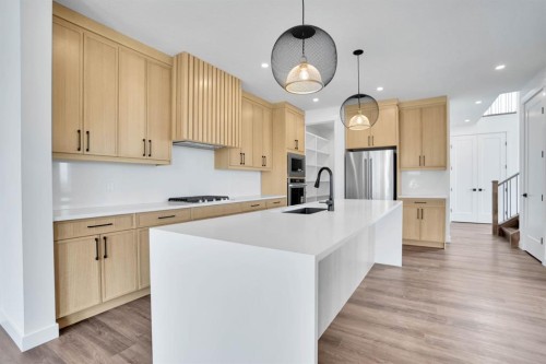 75 Sunvalley Way, Cochrane, AB - Indoor Photo Showing Kitchen With Stainless Steel Kitchen With Upgraded Kitchen