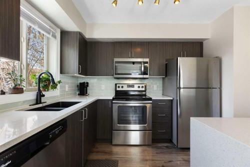 125 Copperpond Common Se, Calgary, AB - Indoor Photo Showing Kitchen With Stainless Steel Kitchen With Double Sink With Upgraded Kitchen