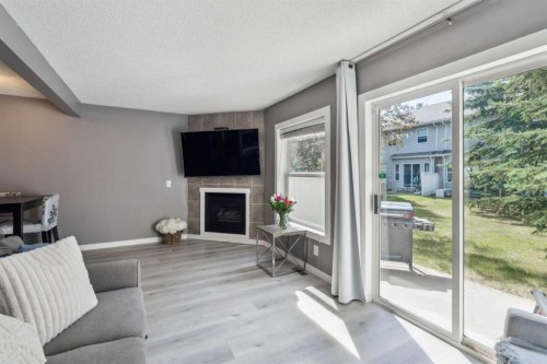 1336 154 Avenue Sw, Calgary, AB - Indoor Photo Showing Living Room With Fireplace