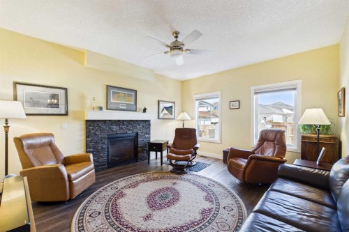 1910 High Park Circle Nw, High River, AB - Indoor Photo Showing Living Room With Fireplace