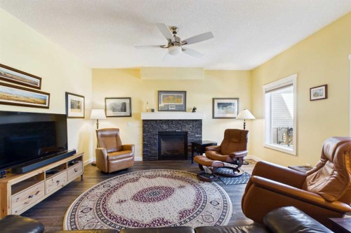 1910 High Park Circle Nw, High River, AB - Indoor Photo Showing Living Room With Fireplace