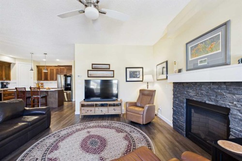 1910 High Park Circle Nw, High River, AB - Indoor Photo Showing Living Room With Fireplace