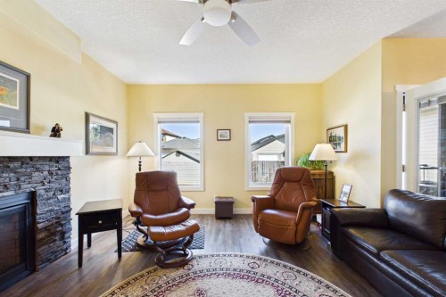 1910 High Park Circle Nw, High River, AB - Indoor Photo Showing Living Room With Fireplace