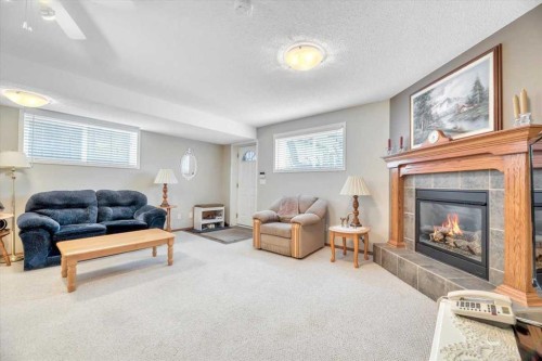 280 Cramond Close Se, Calgary, AB - Indoor Photo Showing Living Room With Fireplace