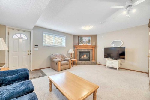 280 Cramond Close Se, Calgary, AB - Indoor Photo Showing Living Room With Fireplace