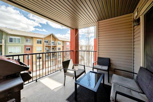1305-403 Mackenzie Way Sw, Airdrie, AB - Outdoor With Balcony With Exterior