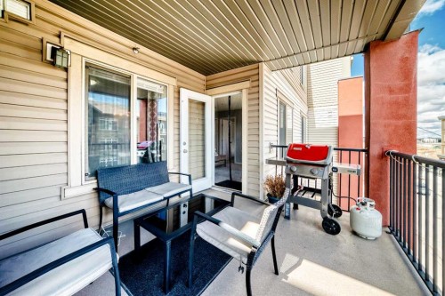 1305-403 Mackenzie Way Sw, Airdrie, AB - Outdoor With Deck Patio Veranda With Exterior