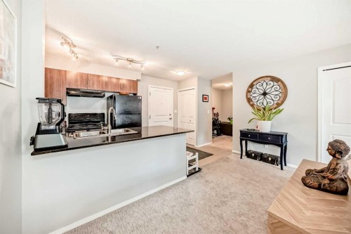 1305-403 Mackenzie Way Sw, Airdrie, AB - Indoor Photo Showing Kitchen