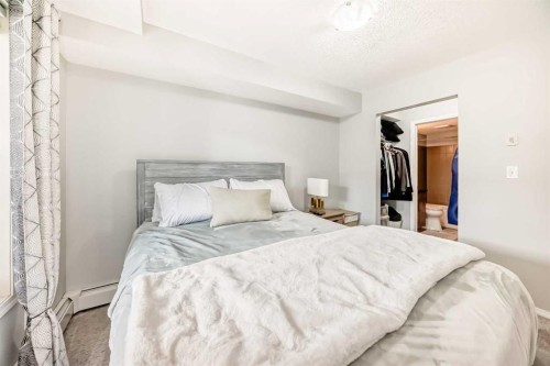 1305-403 Mackenzie Way Sw, Airdrie, AB - Indoor Photo Showing Bedroom