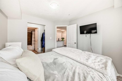 1305-403 Mackenzie Way Sw, Airdrie, AB - Indoor Photo Showing Bedroom