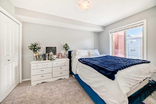 1305-403 Mackenzie Way Sw, Airdrie, AB - Indoor Photo Showing Bedroom