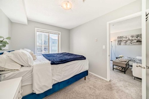 1305-403 Mackenzie Way Sw, Airdrie, AB - Indoor Photo Showing Bedroom