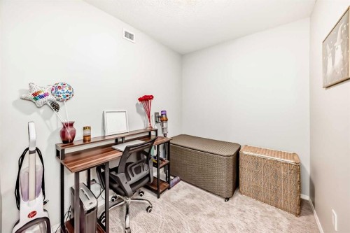 1305-403 Mackenzie Way Sw, Airdrie, AB - Indoor Photo Showing Office