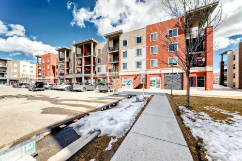 1305-403 Mackenzie Way Sw, Airdrie, AB - Outdoor With Balcony With Facade