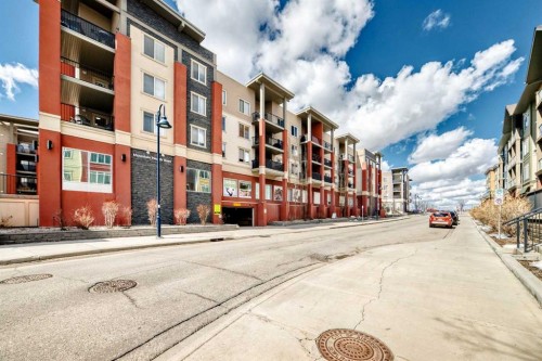 1305-403 Mackenzie Way Sw, Airdrie, AB - Outdoor With Balcony With Facade
