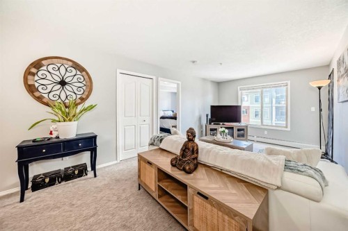 1305-403 Mackenzie Way Sw, Airdrie, AB - Indoor Photo Showing Living Room