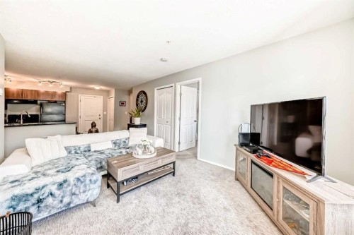 1305-403 Mackenzie Way Sw, Airdrie, AB - Indoor Photo Showing Living Room