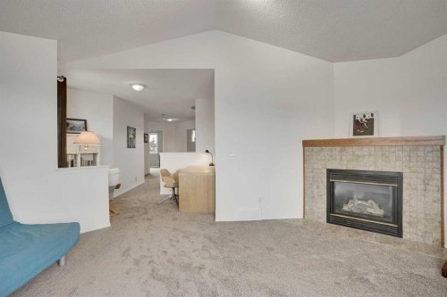 391 Millrise Square Sw, Calgary, AB - Indoor Photo Showing Living Room With Fireplace