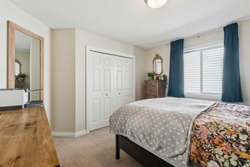 63 Westmount Circle, Okotoks, AB - Indoor Photo Showing Bedroom