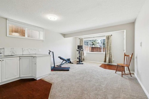 63 Westmount Circle, Okotoks, AB - Indoor Photo Showing Gym Room