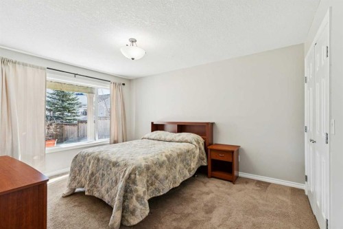 63 Westmount Circle, Okotoks, AB - Indoor Photo Showing Bedroom