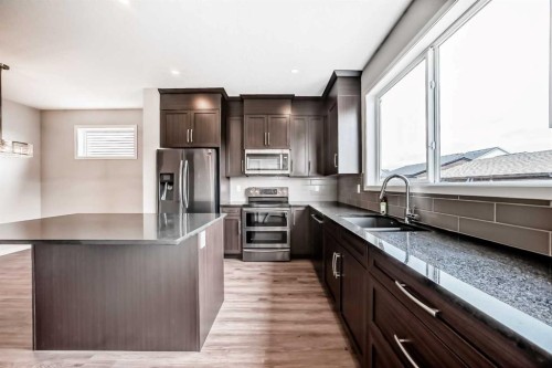 18 Willow Crescent, Okotoks, AB - Indoor Photo Showing Kitchen With Stainless Steel Kitchen With Upgraded Kitchen