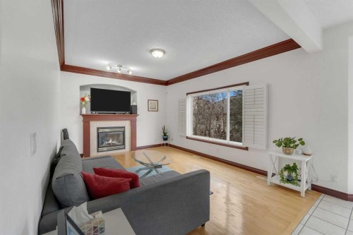 113 West Creek Pond, Chestermere, AB - Indoor Photo Showing Living Room With Fireplace