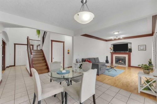 113 West Creek Pond, Chestermere, AB - Indoor Photo Showing Other Room With Fireplace