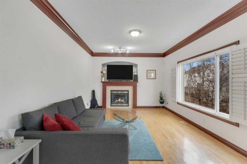 113 West Creek Pond, Chestermere, AB - Indoor Photo Showing Living Room With Fireplace