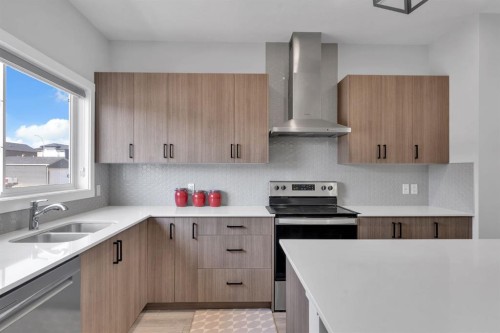 67 Corner Glen Gardens Ne, Calgary, AB - Indoor Photo Showing Kitchen With Stainless Steel Kitchen With Double Sink With Upgraded Kitchen