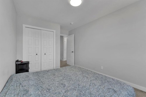67 Corner Glen Gardens Ne, Calgary, AB - Indoor Photo Showing Bedroom