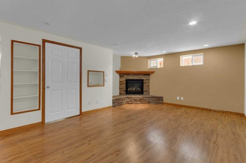 31 Gateway Drive Sw, Calgary, AB - Indoor Photo Showing Other Room With Fireplace