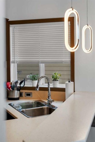 265 Bridlemeadows Common Sw, Calgary, AB - Indoor Photo Showing Kitchen With Double Sink
