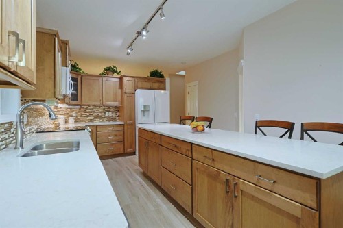 13 Scimitar Heath Nw, Calgary, AB - Indoor Photo Showing Kitchen With Double Sink