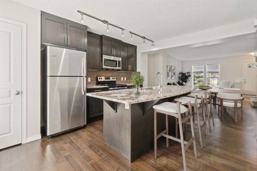 10 Auburn Bay Common Se, Calgary, AB - Indoor Photo Showing Kitchen With Stainless Steel Kitchen With Upgraded Kitchen